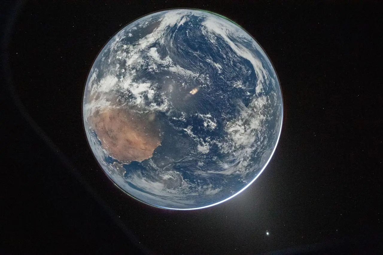 Earth seen from deep space near the Moon during Artemis era